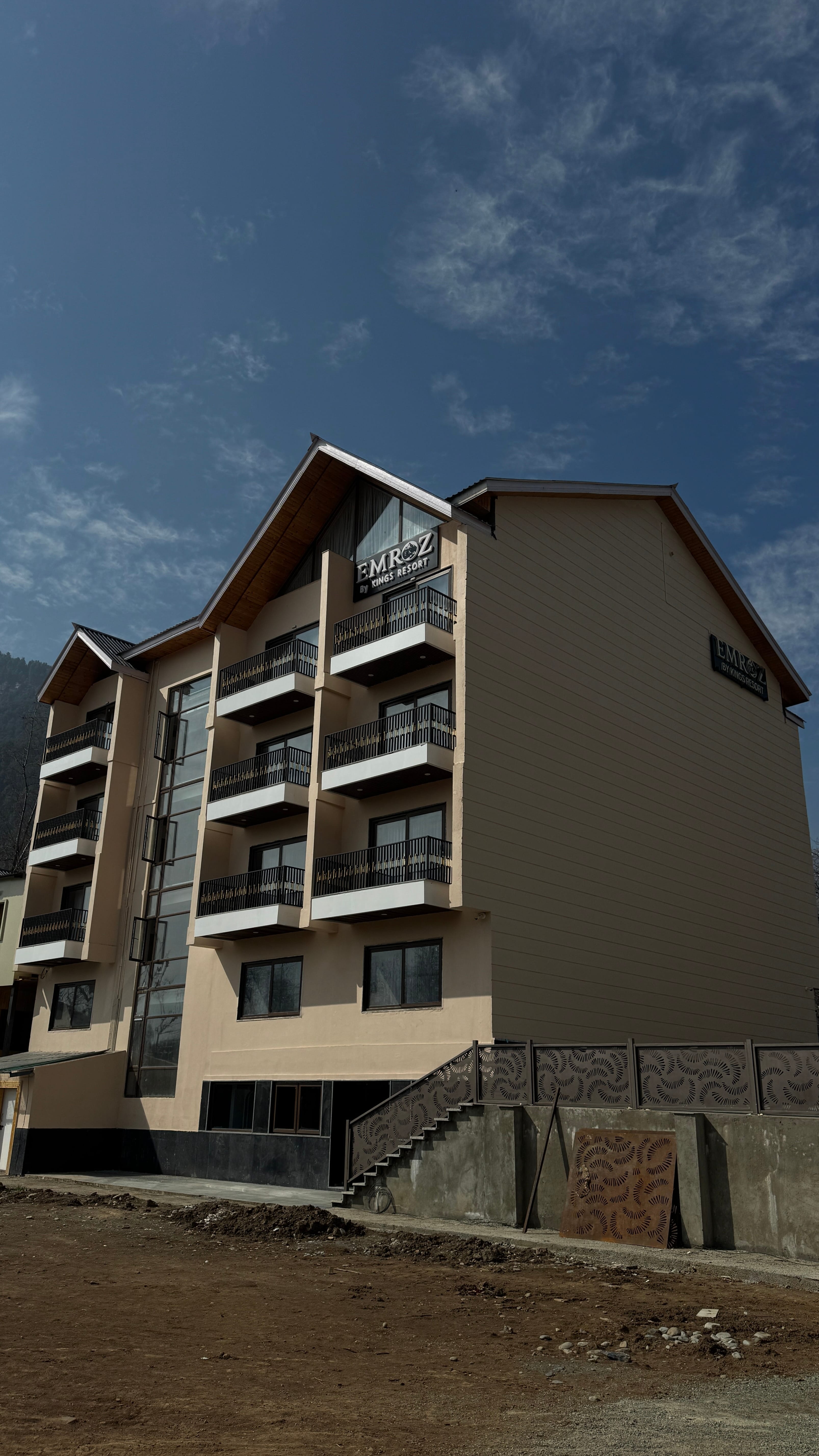 Emroz by Kings Resort façade with Himalayan mountains