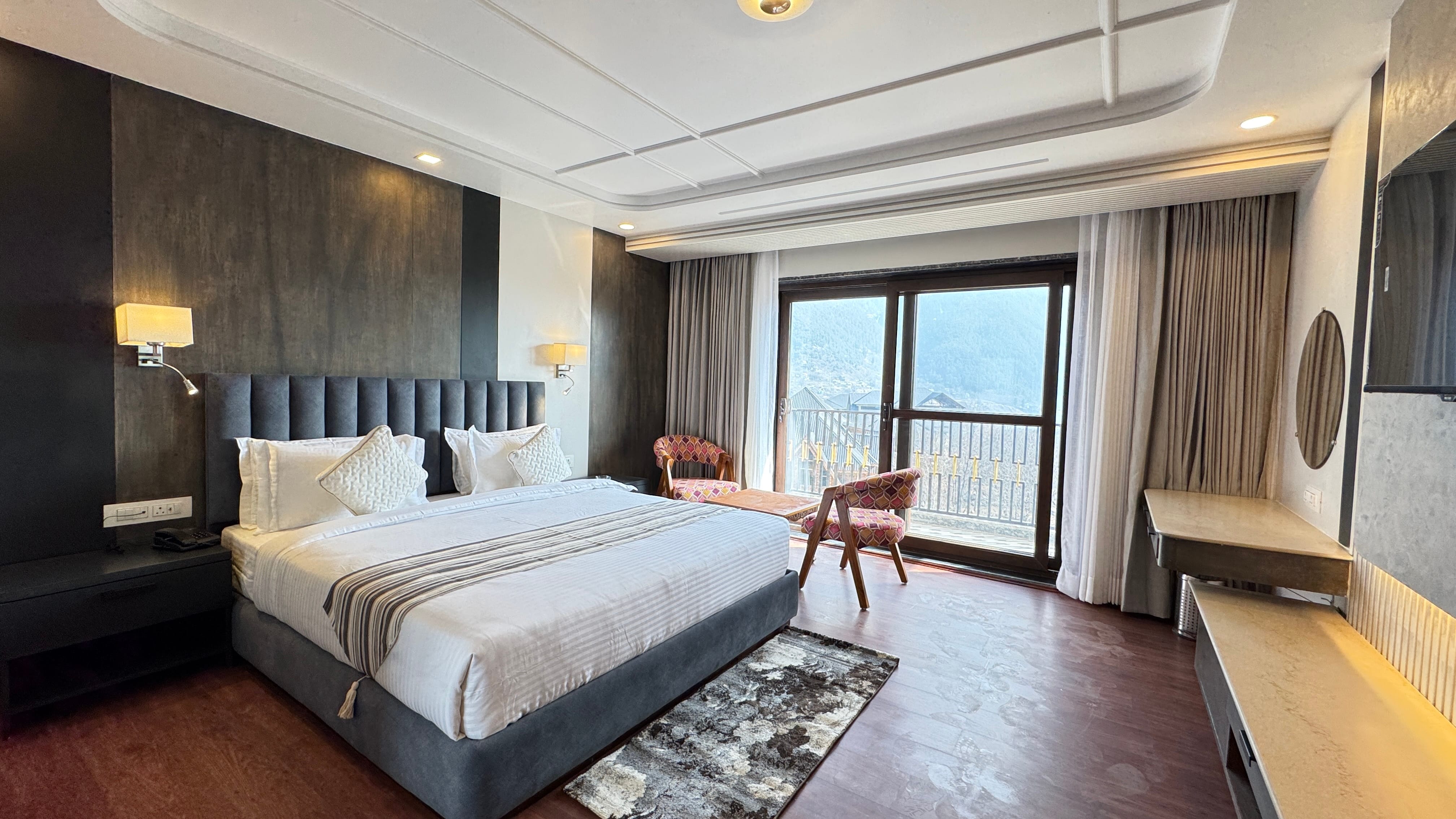 Premium deluxe room with mountain view balcony at Emroz by Kings Resort